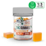 A jar of CBDfx Limited-Edition Pumpkin Spice THC Gummies. Each gummy contains 10mg of THC and 30mg of CBD, making it a 1:3 ratio of THC to CBD. The gummies are sativa-dominant and come in a pumpkin spice flavor.